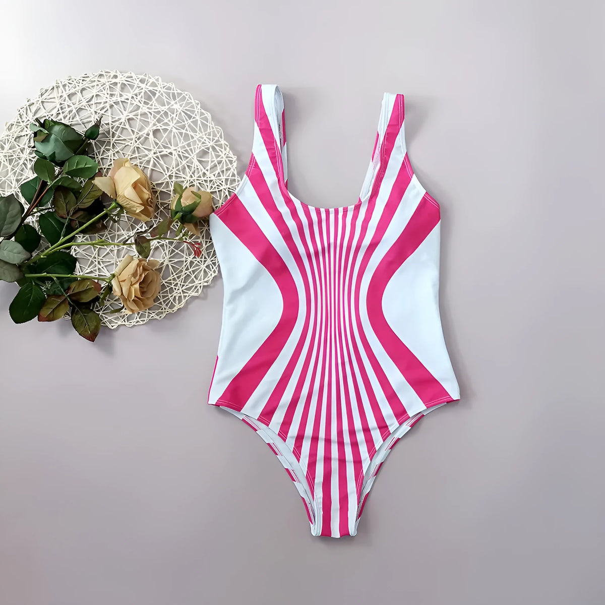 Women's pink striped one-piece swimsuit with digital printing on front and back.