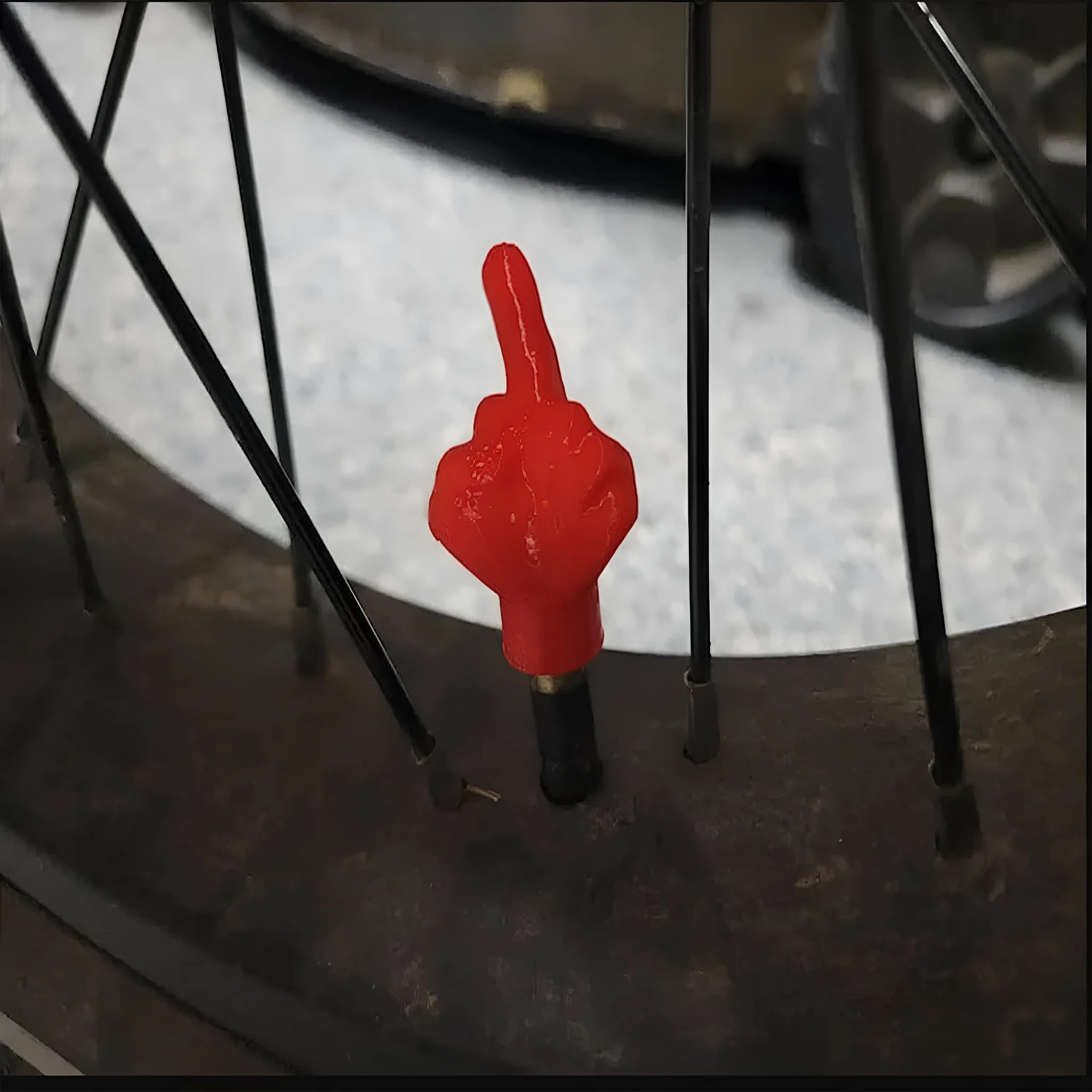Four latex rubber tyre valve dust caps showing two black and two skin colour pieces