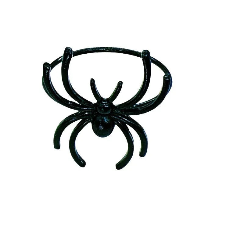 Set of six black alloy napkin rings with spider pattern design for Halloween table decoration