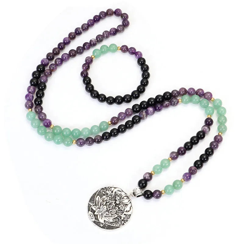 Dongling Long handmade stone bead necklace with alloy lotus pendant and matching bracelet.