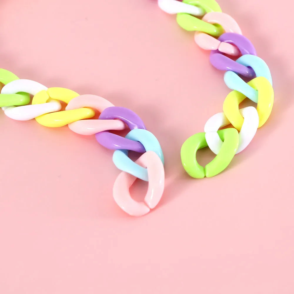 Adjustable plastic pet collar in macaron candy colours showing chain blue, pink and mixed options