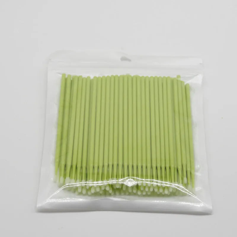 Disposable micro applicator brushes with bendable cotton tips and colour-coded handles for eyelash extensions