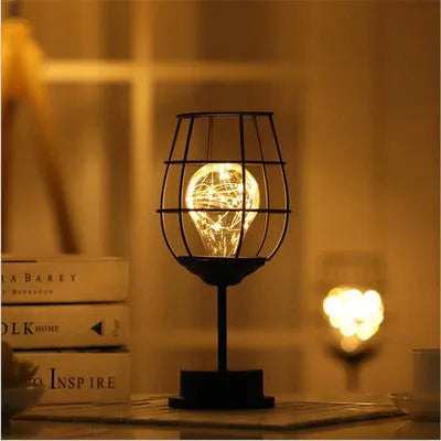 Minimalist iron hollow table lamp with wine bottle design and warm white LED lighting