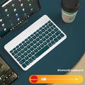 Girls Bluetooth tablet keyboard in multiple colour options including white, green, and pink on a desk