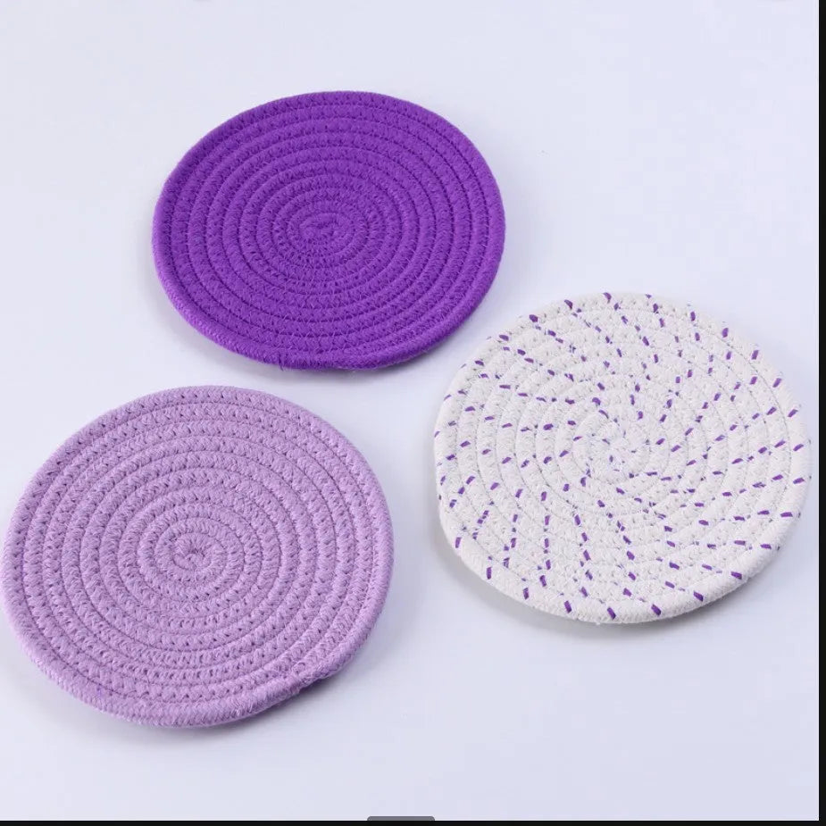 Three round 18cm cotton cord coasters in a set, shown in a blue colour option.