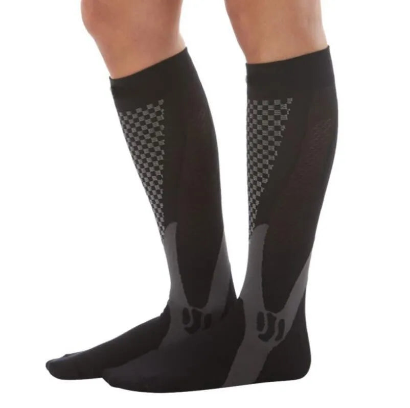 A pair of graduated compression socks for men and women in an athletic style, shown in a colour option like black or blue.