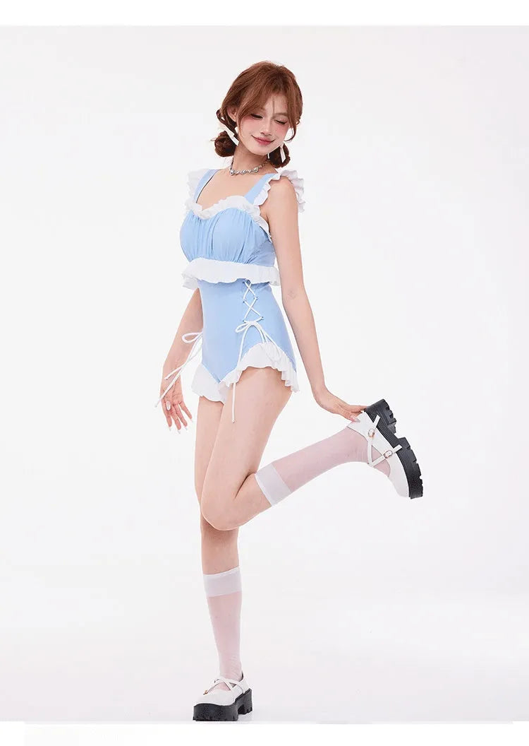 Light blue women's high waist one-piece swimsuit with lace detailing and a backless design.