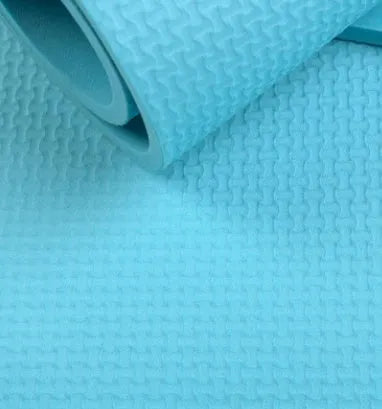 EVA yoga mat in blue showing textured anti-skid surface with thickness options
