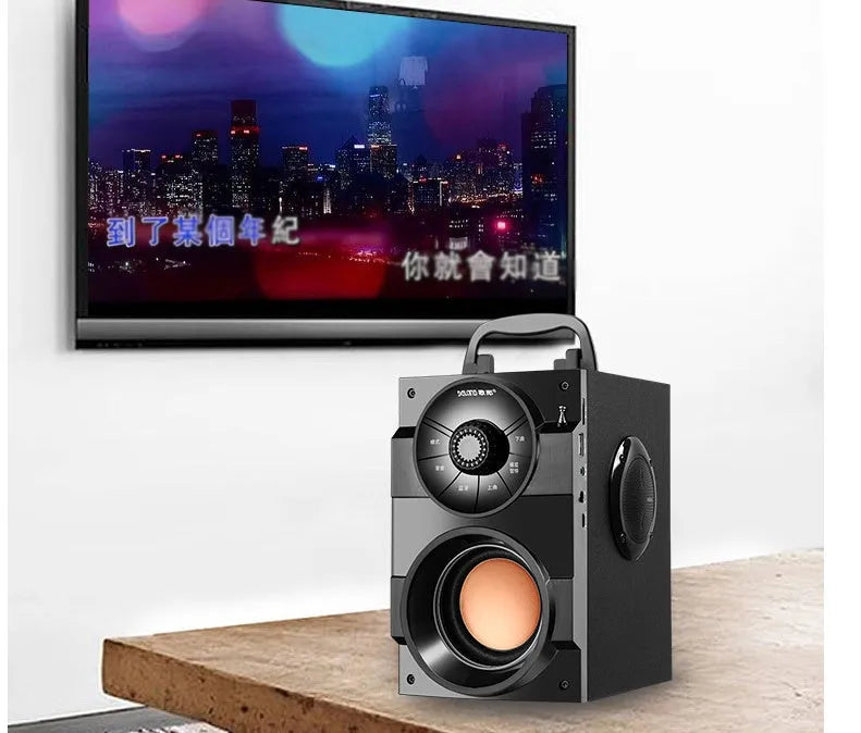 Black portable mini home audio system with subwoofer, satellite speakers, and a 3.5mm audio cable