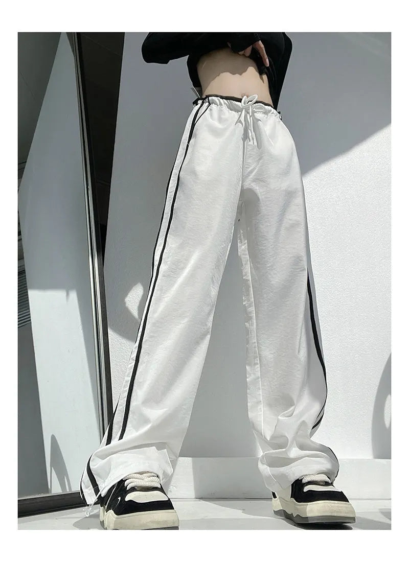 Low-waist loose straight-leg trousers with ribbon parallel bars detail in navy blue
