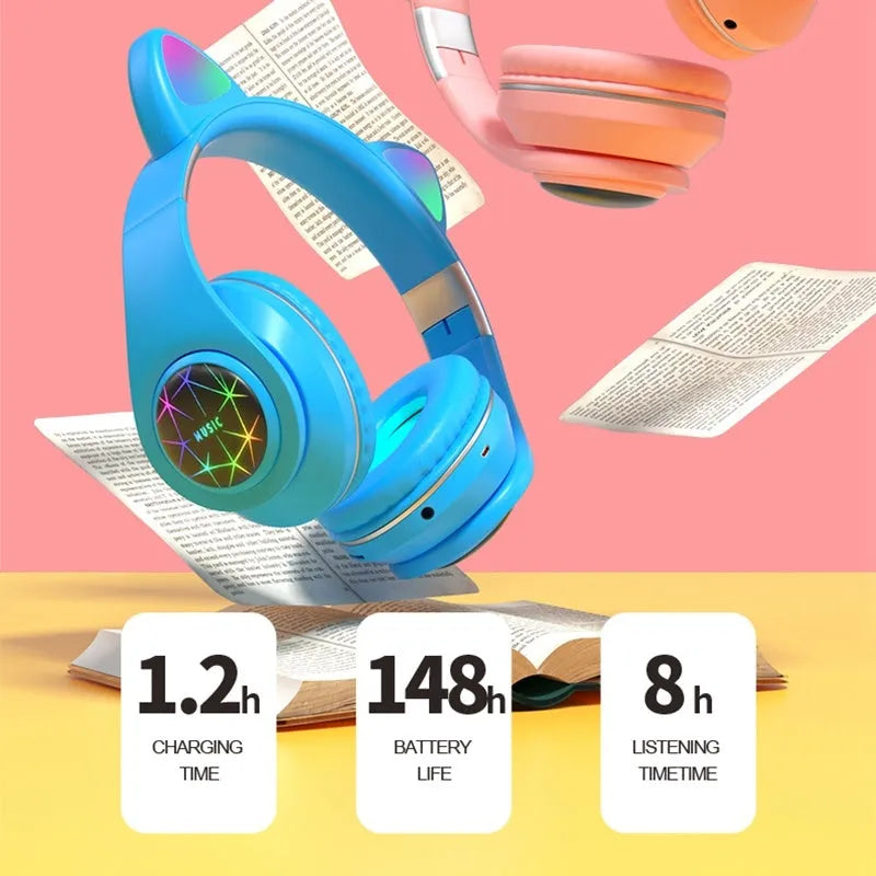 Colourful cat ear style wireless Bluetooth sports headset with a headband, shown in pink.
