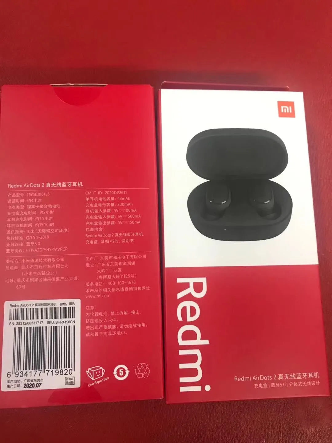 Black Redmi AirDots 2 true wireless earbuds and charging case on a white background.