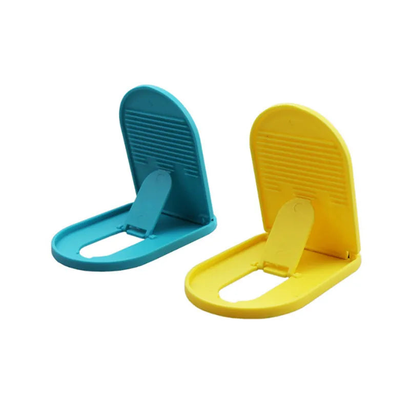 Plastic lazy bracket mobile phone stand in six colour options: black, blue, grey, pink, white, and yellow.