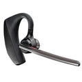 Black Bluetooth sports headphones with USB charging port showing battery display