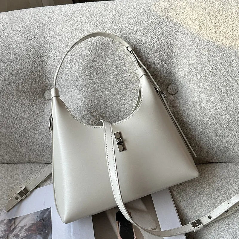 Genuine leather crossbody shoulder bag with dumpling shape and sandwich pocket design