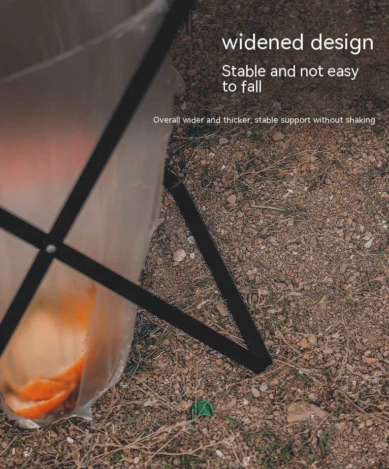 Black folding iron outdoor trash rack with a wooden handle holding a waste bag.