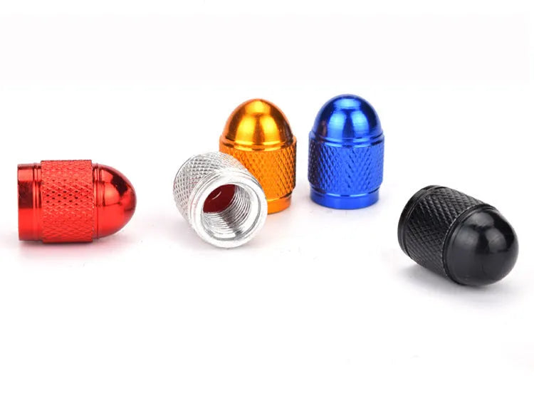 Aluminium mountain bike tyre valve dust cap in assorted colours: black, blue, gold, red, silver.