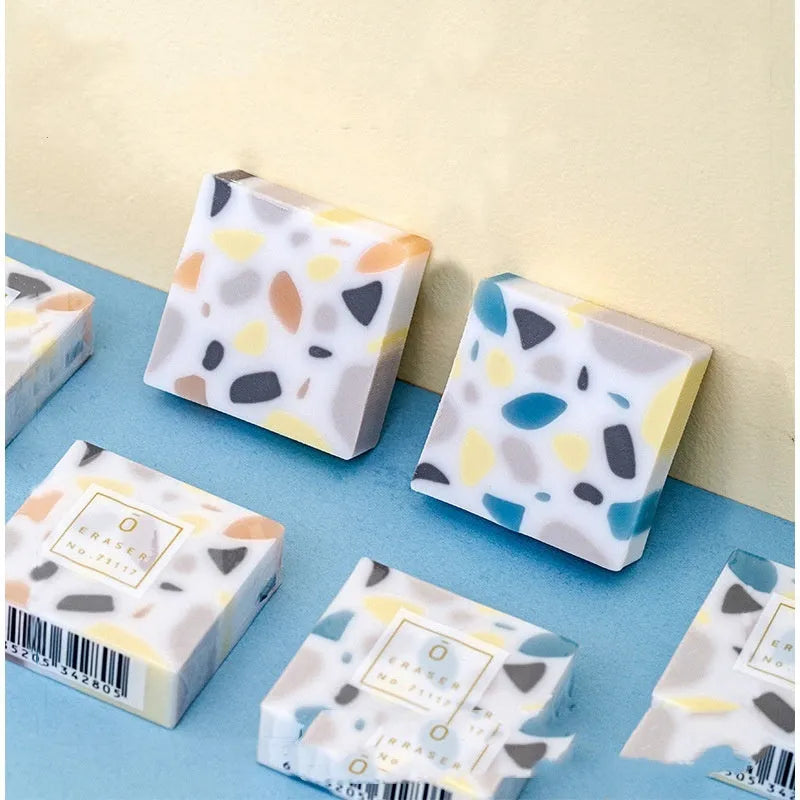 Super Clean Traceless brick design rubber eraser on a white background.