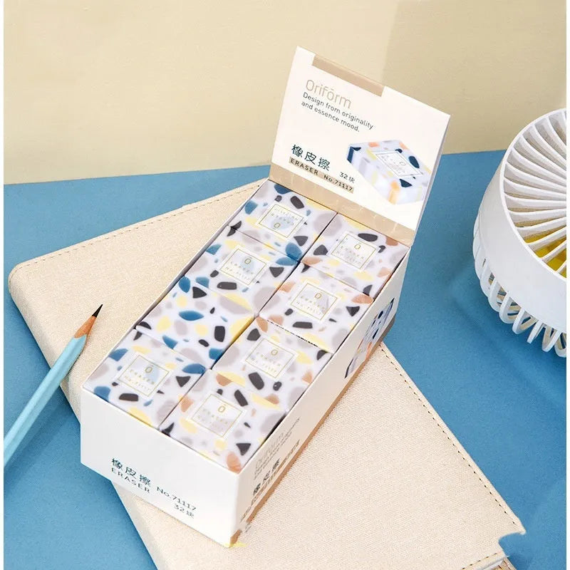 Super Clean Traceless brick design rubber eraser on a white background.
