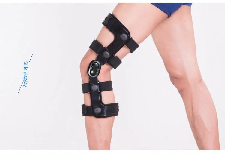 Black anterior ligament knee pad showing multi-material construction and sizing tags for left and right knees.