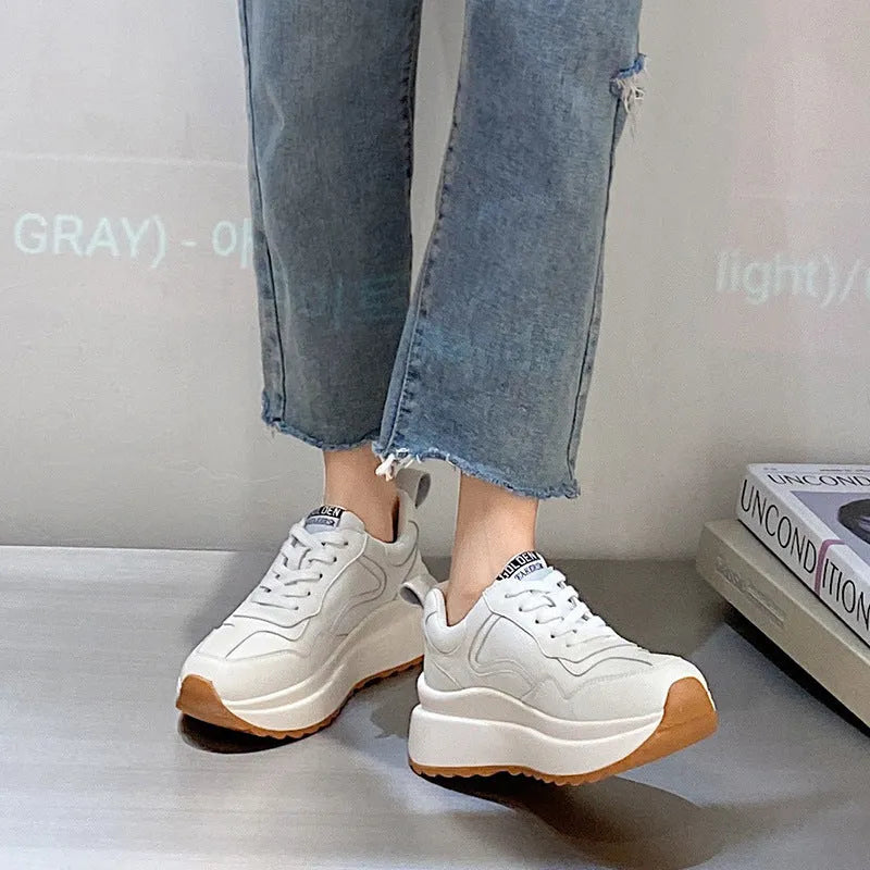 Women's white leather casual sports shoes with cross strap and English muffin heel detail