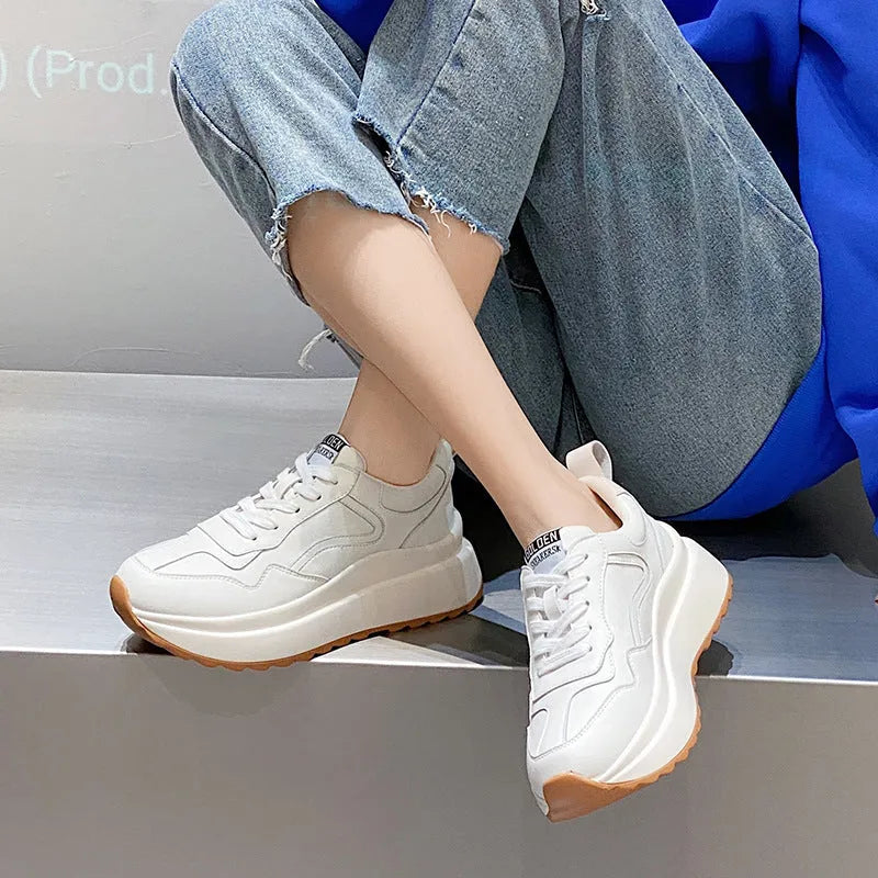Women's white leather casual sports shoes with cross strap and English muffin heel detail
