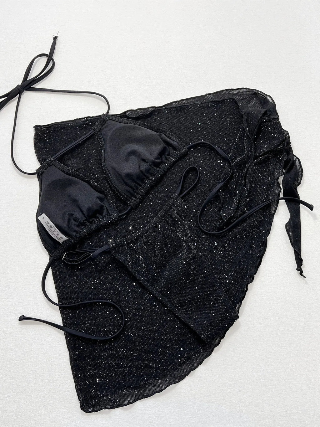 Black three piece bikini swimsuit set with separated top and shorts