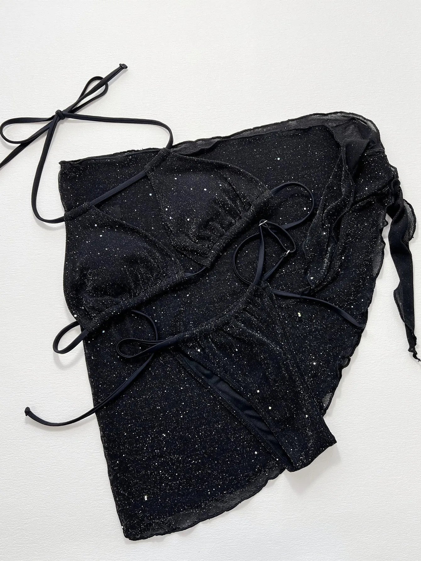 Black three piece bikini swimsuit set with separated top and shorts