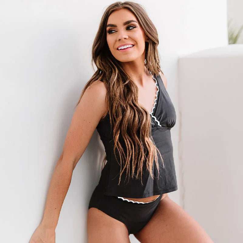 Black women's one-piece swimsuit with sleeveless design and split-side construction