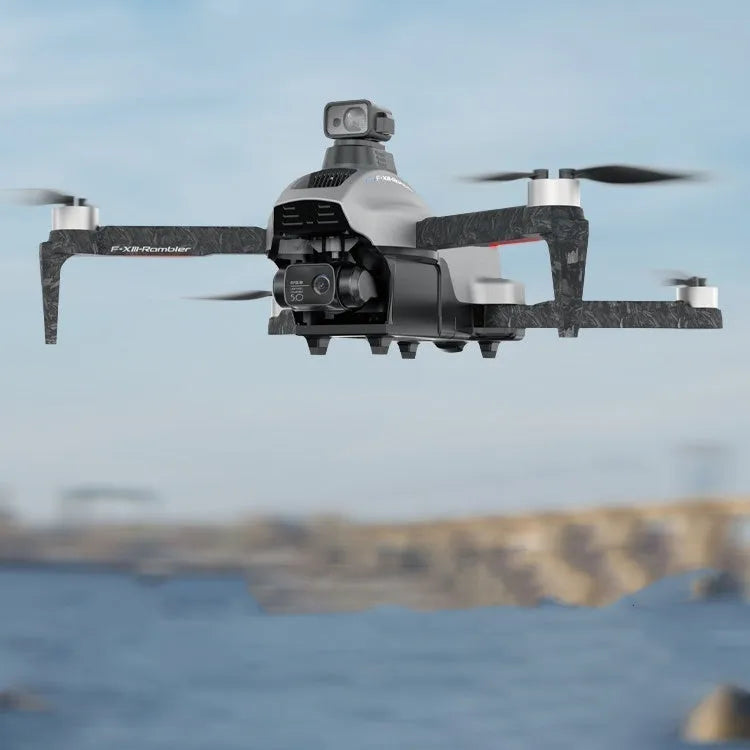 White folding quadcopter drone with camera and propellers, shown next to its remote control and shoulder bag.