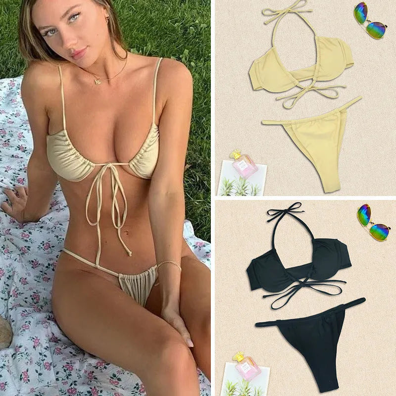 Women's black and mint green split design bikini swimsuit set on a mannequin.