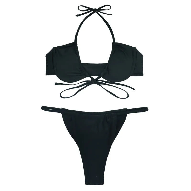 Women's black and mint green split design bikini swimsuit set on a mannequin.