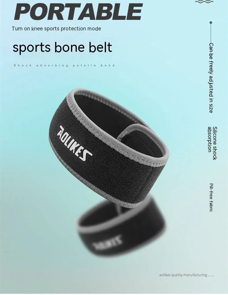 Black and grey patella retinaculum knee support for adult sports use.