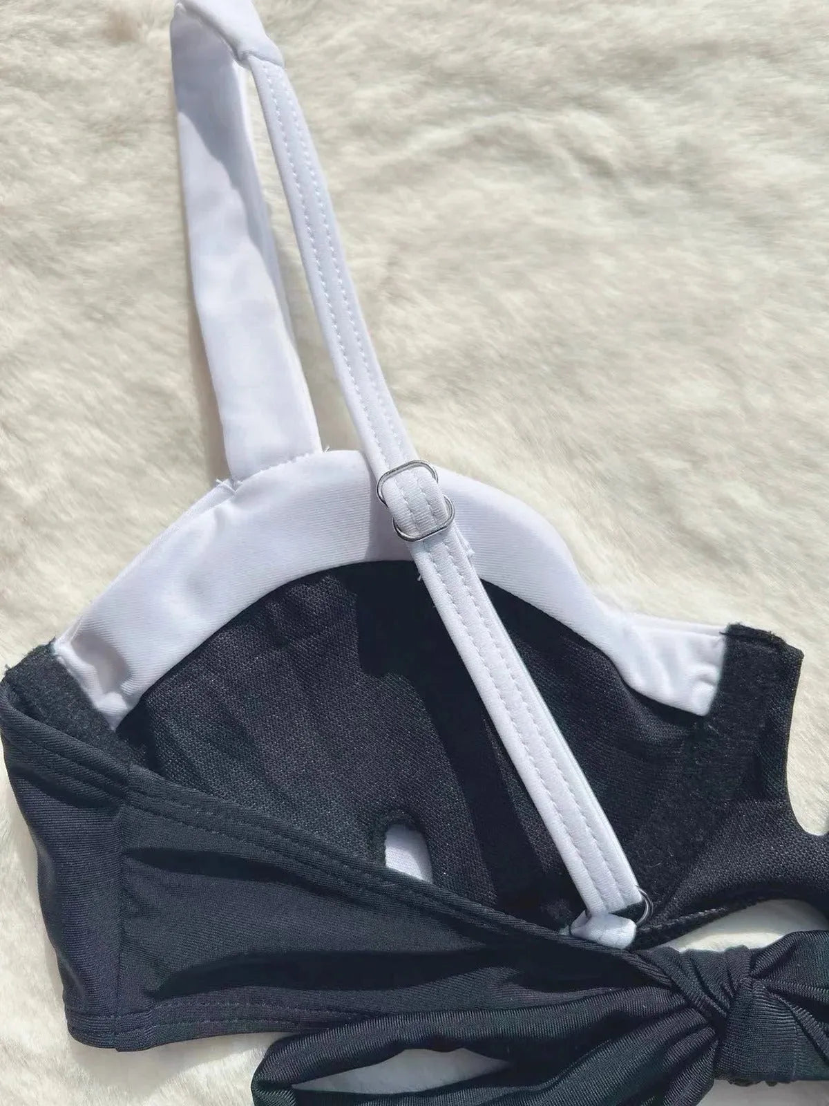 Black low waist women's bikini swimsuit with stitching detail and split design