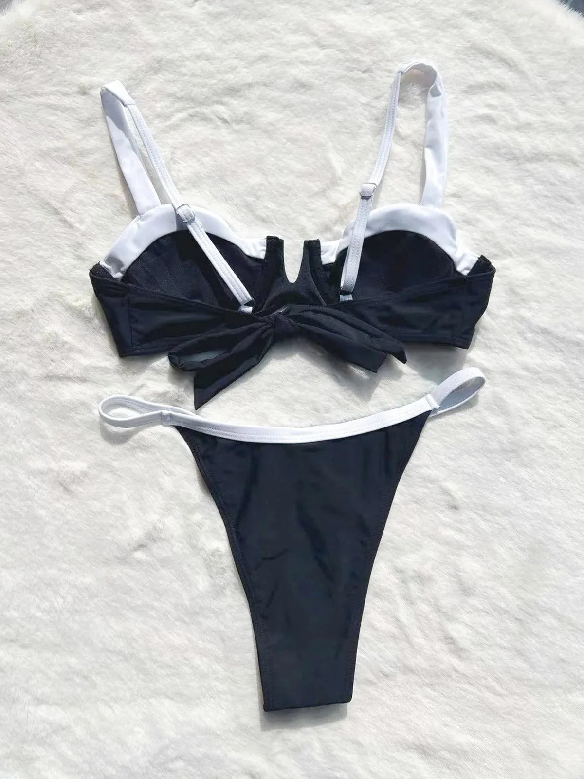 Black low waist women's bikini swimsuit with stitching detail and split design