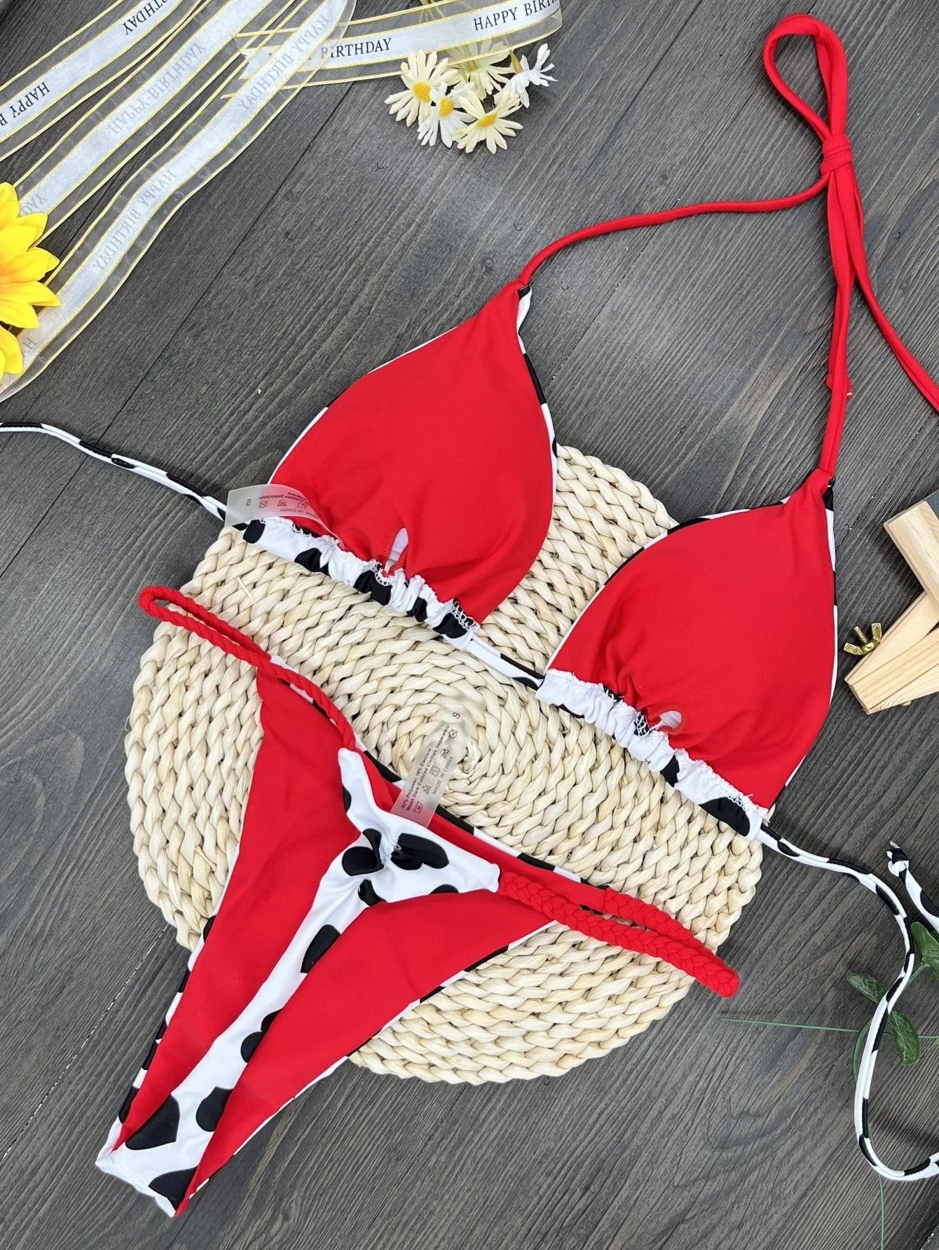 Backless one-piece swimsuit with heart print and split leg in nylon fabric.