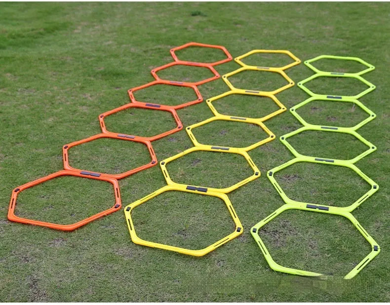 Set of six foldable hexagon football agility training rings in green, orange and yellow PP plastic