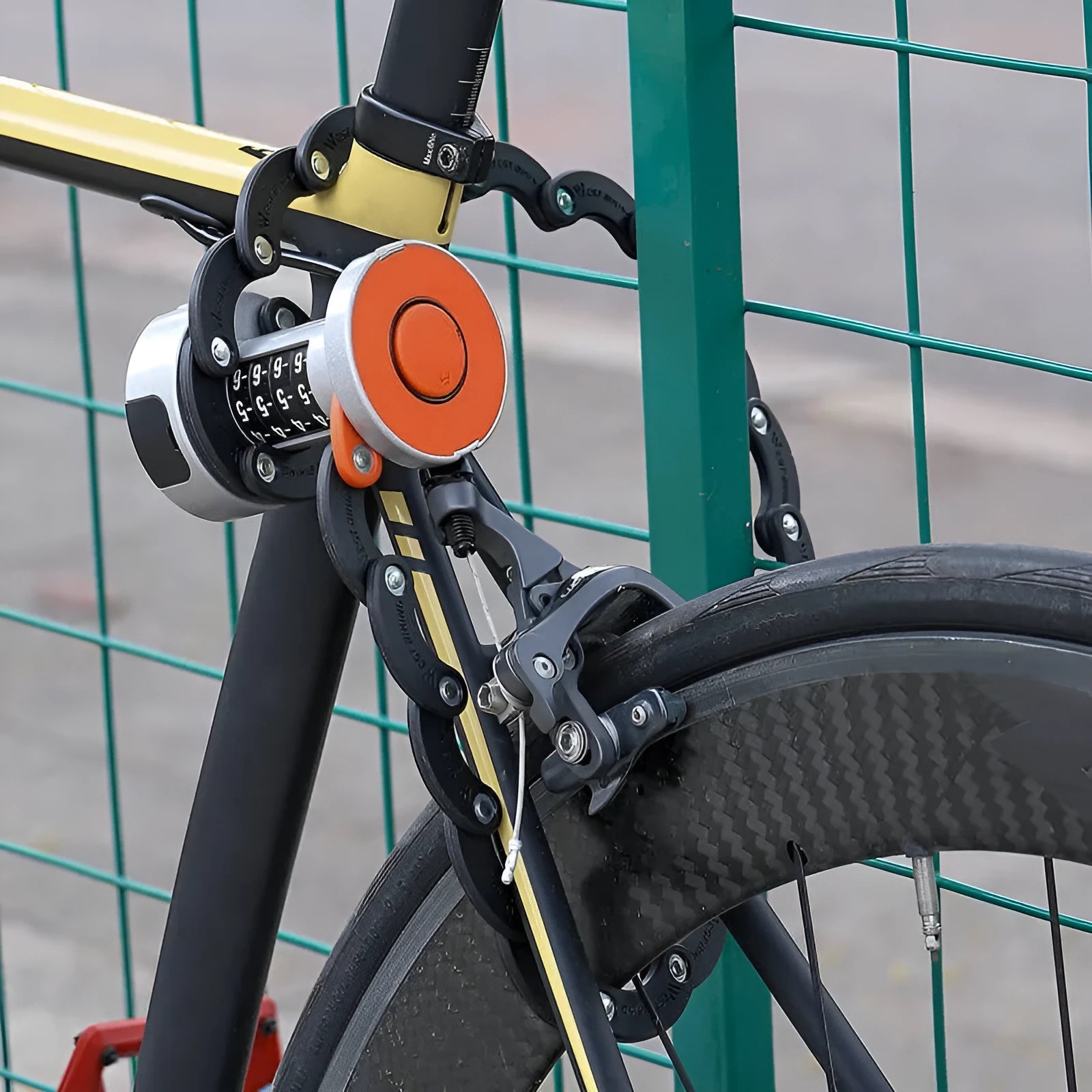 Black folding bicycle lock with zinc alloy and steel construction in compact folded position