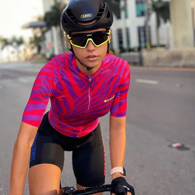 Attaquer women's cycling jersey and bib shorts set in a vibrant kaleidoscope pattern.