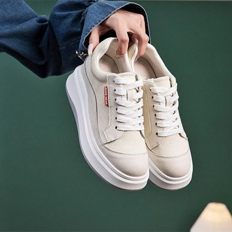 Beige and pink women's leather board shoes with thick soles on a white background.