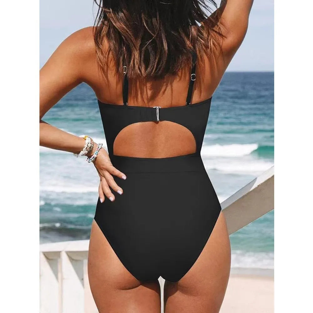 Black women's strapless one-piece swimsuit with cross-back detail on a mannequin.
