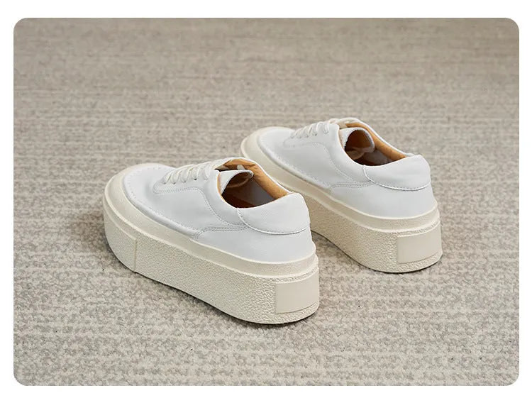 Women's black platform casual sports shoes with embossed cowhide upper and tied lace design