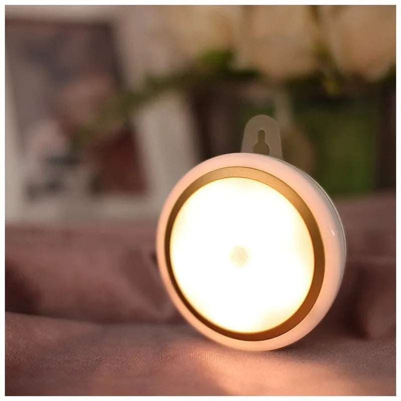Smart battery-powered motion sensor LED night light with 80mm white casing on a wall