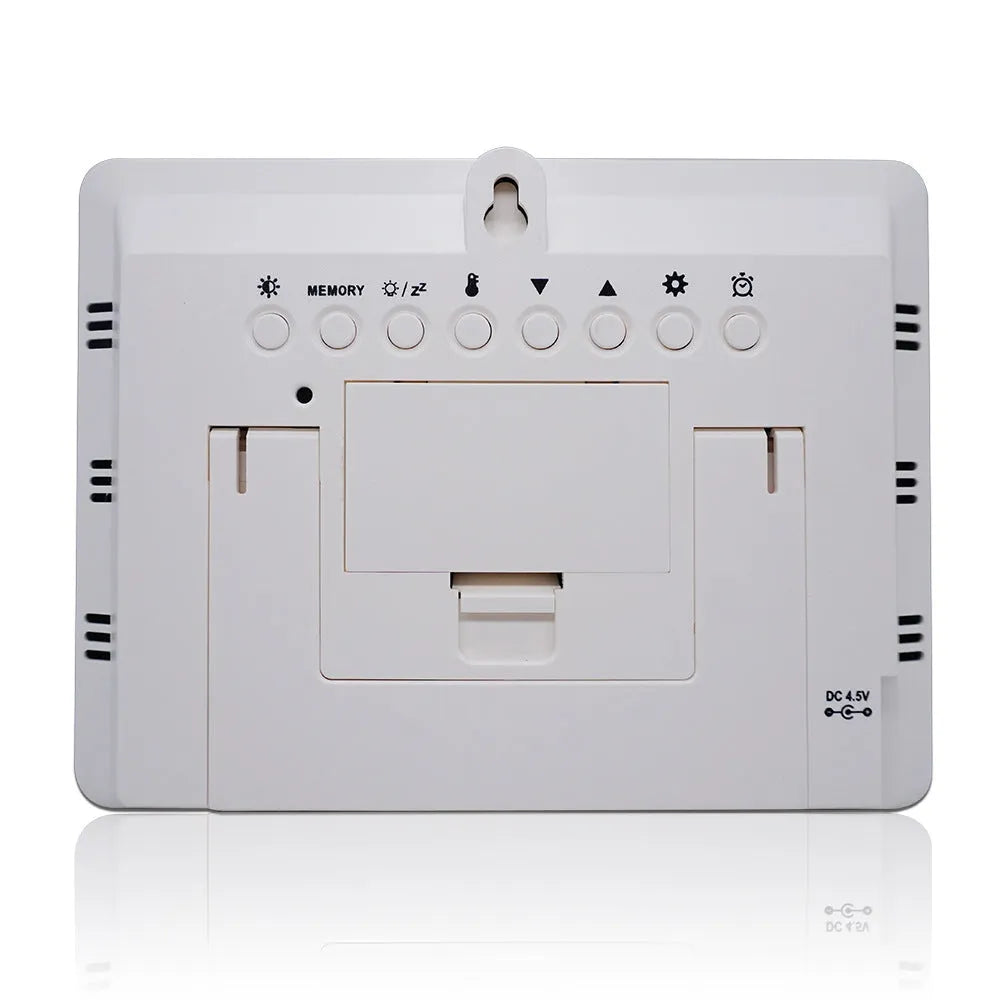 Digital weather station clock with LCD display showing temperature humidity and forecast in black plastic case