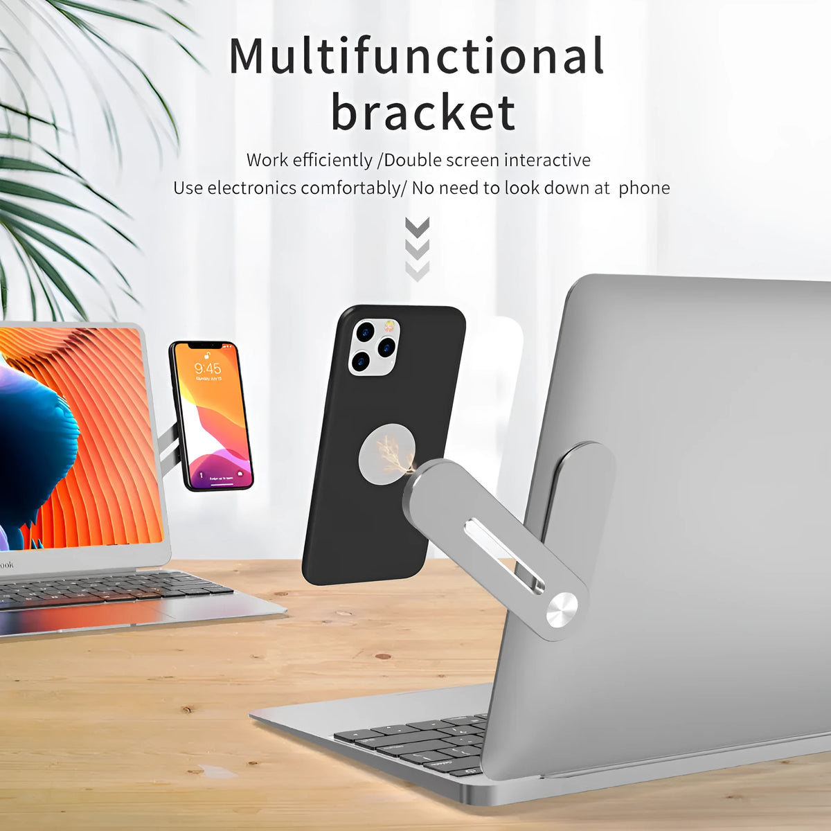Aluminium laptop side mount bracket holding a mobile phone next to a computer screen.