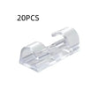 Transparent self-adhesive plastic cable clips in four different sizes for wire management.