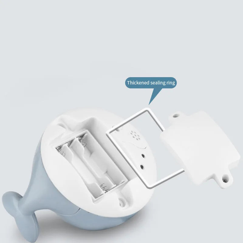 Whale-shaped bath toy with water spray feature and LED lights for baby bath time sensory play
