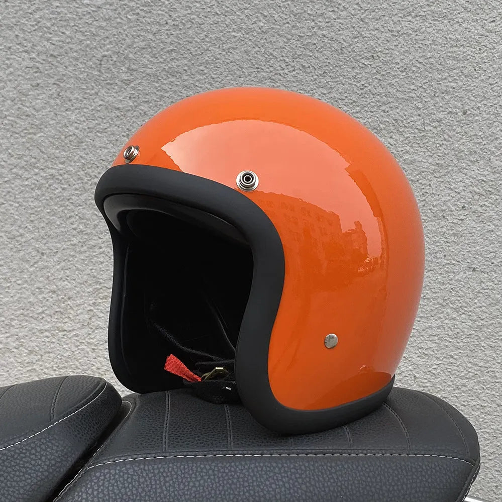 Retro-style half-shell motorcycle helmet in fibreglass, shown in a cement grey colour option.