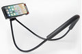 White universal neck phone holder with 360-degree rotating clamp holding a smartphone