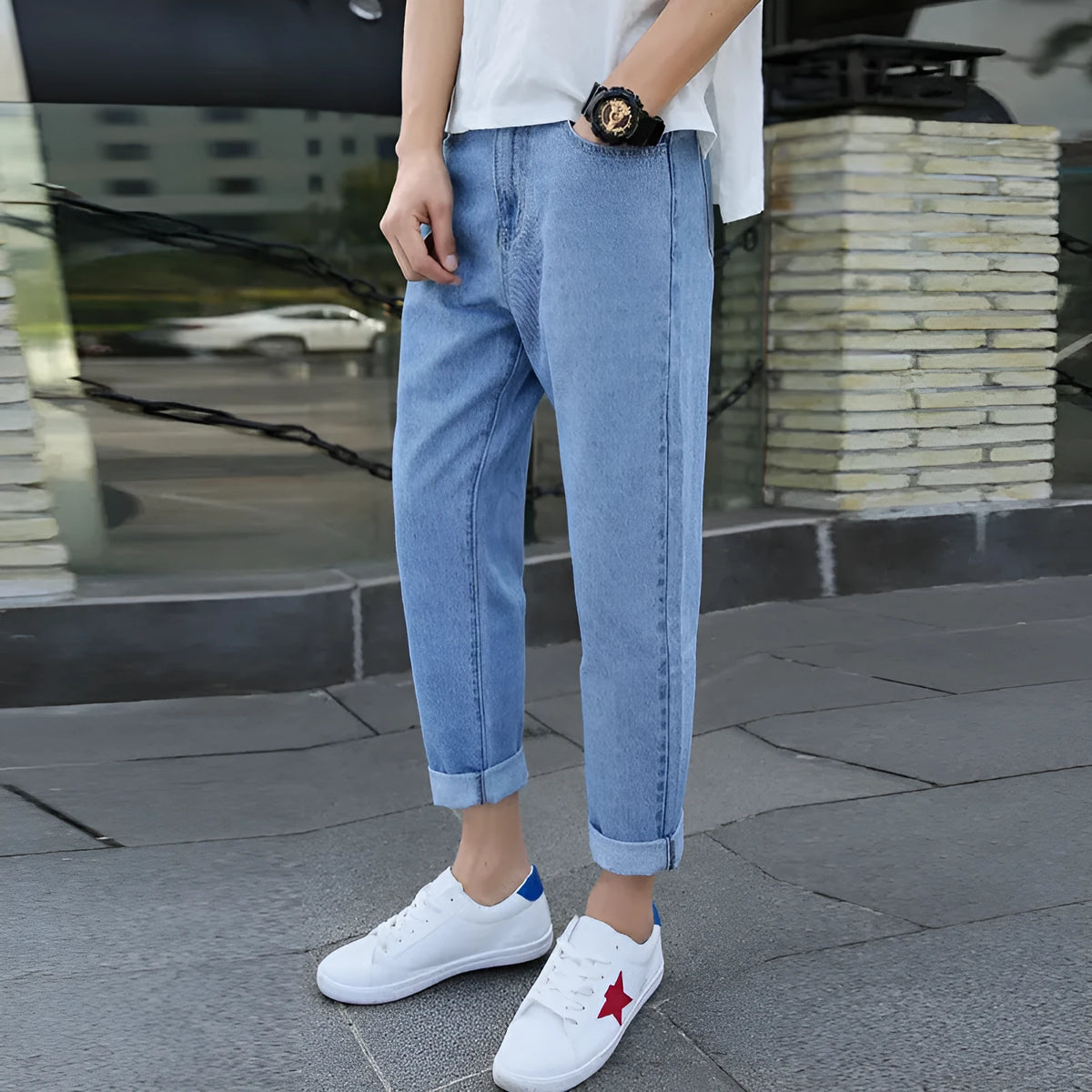 Men's loose straight leg cotton jeans in black, showing relaxed fit and light straight leg opening.